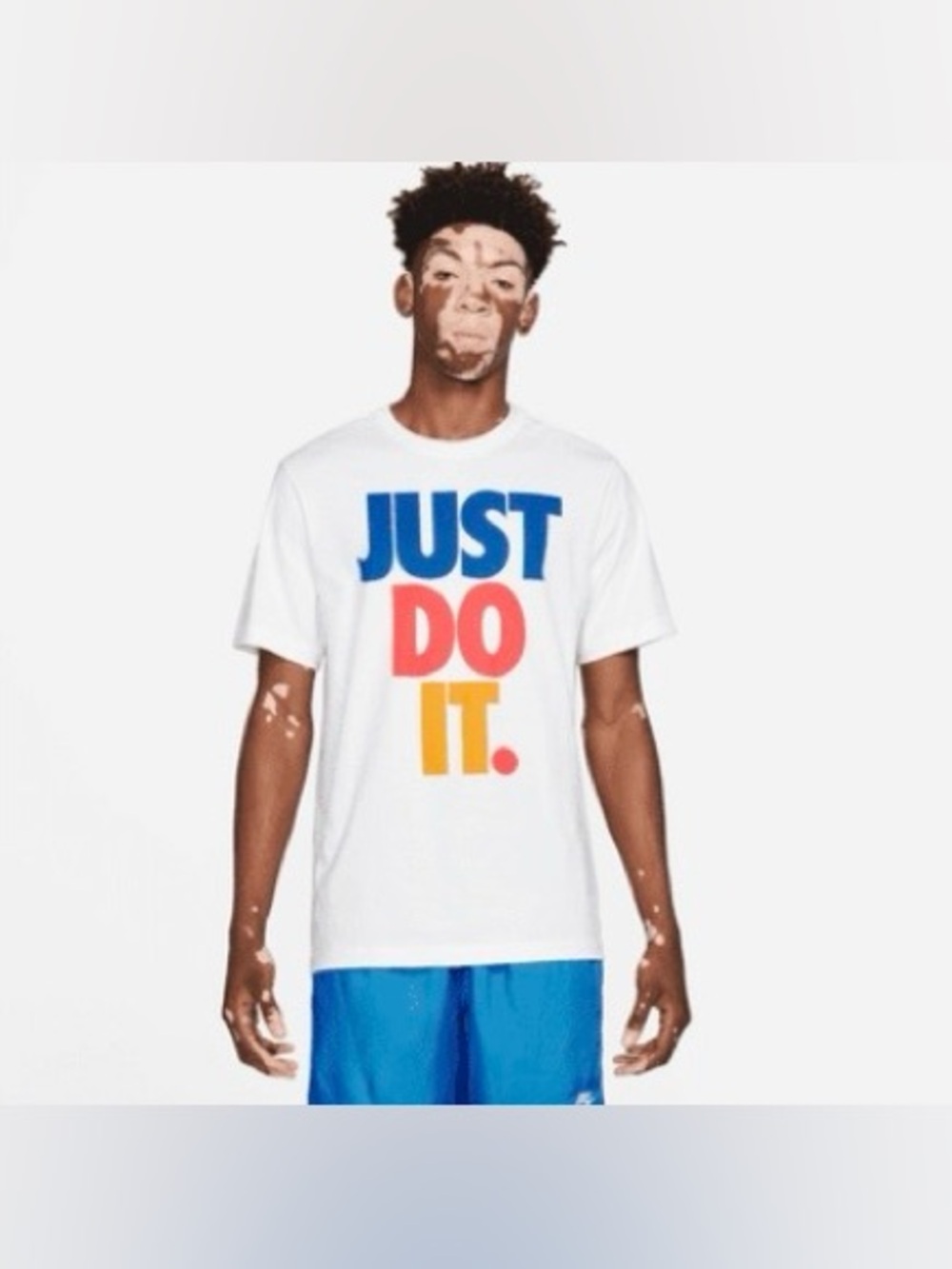 Nike Sportswear Men's T-Shirt with a multi-colored "Just Do It" graphic Medium
